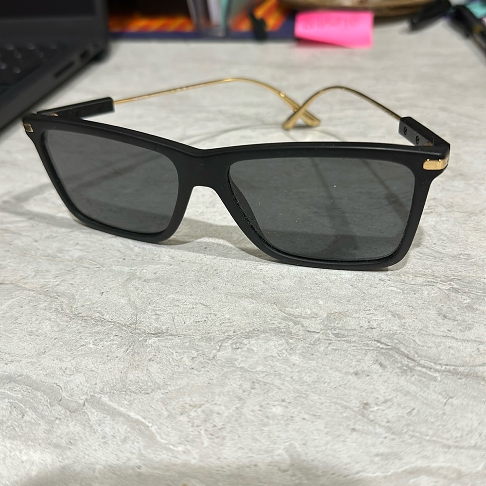 Brand nee Prada Unisex Sunglasses with case. Brand new with polarized lenses.